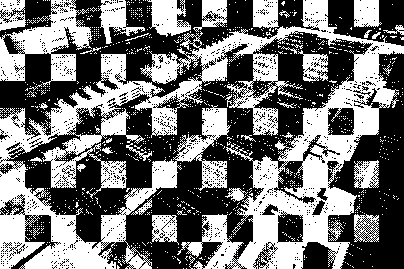 The roof of a data centre seen from above, with long rows of cooling units and backup generators