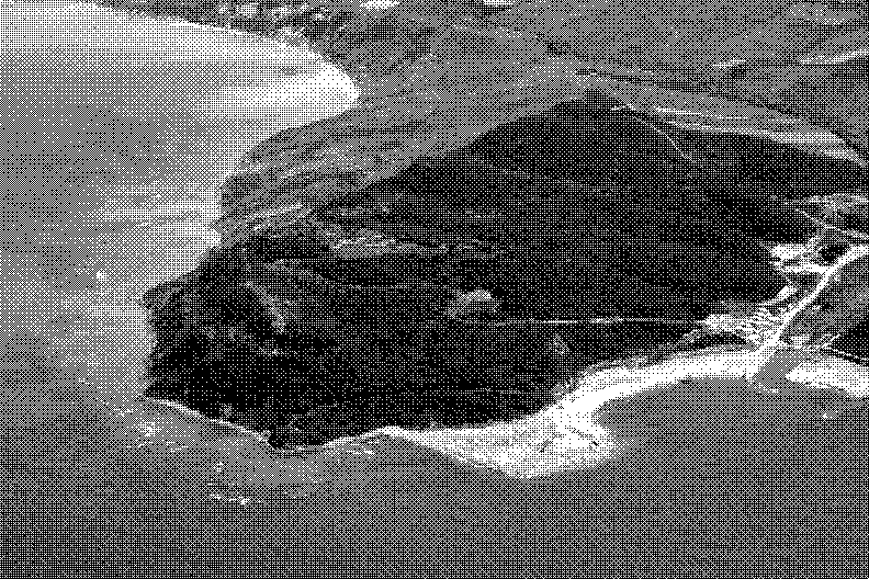 An aerial view of Kepi i Lagjit, a wooded headland on the Albanian coast, with a beach beside it